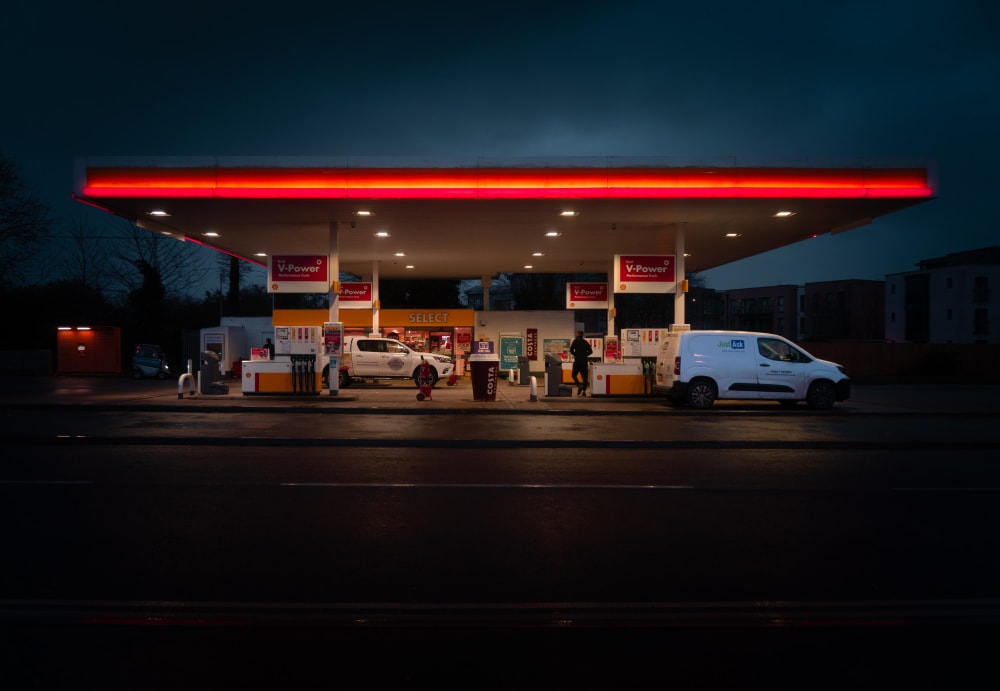A UK fuel station at night